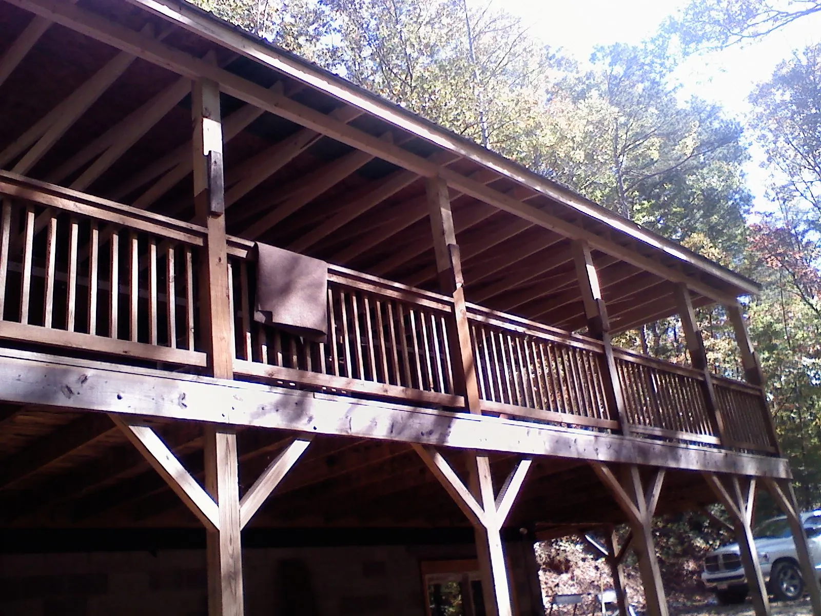 Timber framing under a new elevated porch and deck — Roof Leak Repair in Sanbornville by Roofing Brothers
